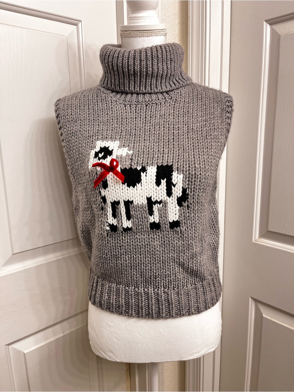 Cider Gray Turtleneck Sweater Vest with Cow Intarsia and Red Bow